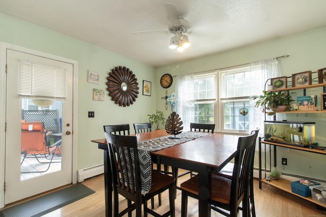 47 Pebble Dr, Newington, CT 06111 - dining space with baseboard heating, light wood-style flooring, and a ceiling fan