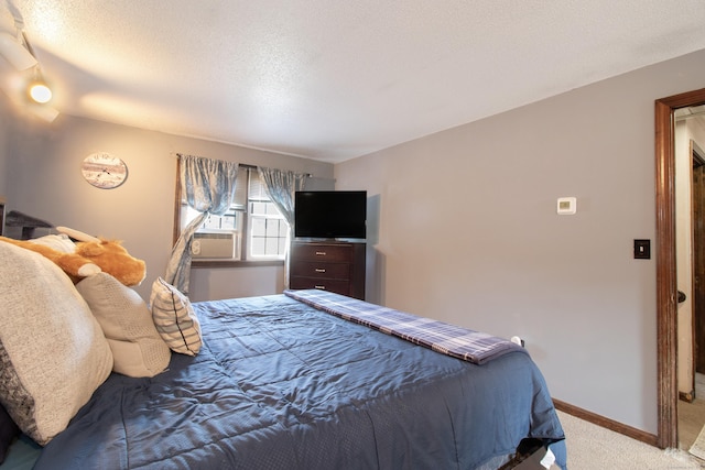47 Pebble Dr, Newington, CT 06111 - bedroom featuring light carpet, cooling unit, and a textured ceiling