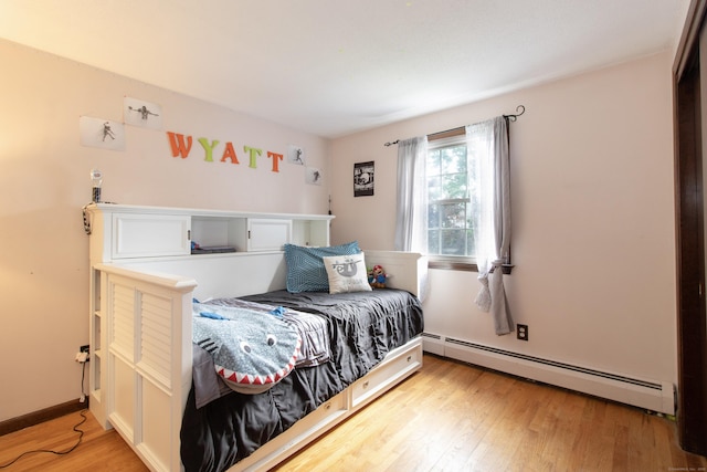 47 Pebble Dr, Newington, CT 06111 - bedroom with a baseboard heating unit and light wood finished floors
