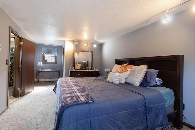 47 Pebble Dr, Newington, CT 06111 - carpeted bedroom with a textured ceiling, track lighting, and baseboard heating
