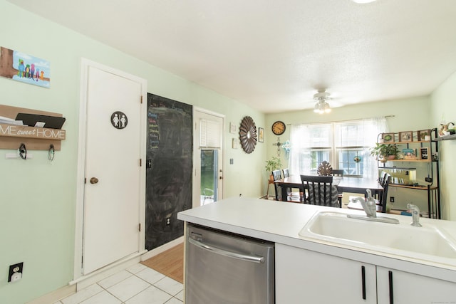 47 Pebble Dr, Newington, CT 06111 - kitchen featuring stainless steel dishwasher, light tile patterned floors, a ceiling fan, and light countertops