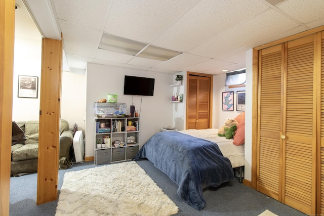 47 Pebble Dr, Newington, CT 06111 - carpeted bedroom with a paneled ceiling and two closets