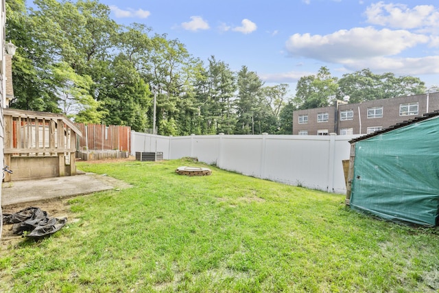 3 Price Ct, East Hartford, CT 06108 - view of yard featuring a fire pit and central AC