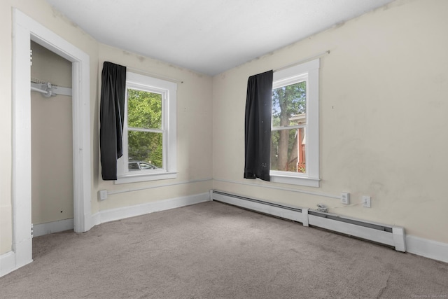 3 Price Ct, East Hartford, CT 06108 - unfurnished bedroom with carpet floors, multiple windows, a baseboard heating unit, and baseboards