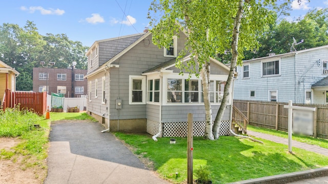 3 Price Ct, East Hartford, CT 06108 - view of front of property with a sunroom and driveway