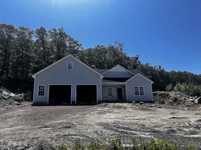 74 Rock Ridge Rd, Manchester, CT 06040 - view of front of house featuring an attached garage and dirt driveway