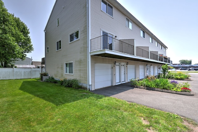 269 Captain Thomas Blvd Unit 12, West Haven, CT 06516 - view of home's exterior featuring a balcony, an attached garage, and driveway