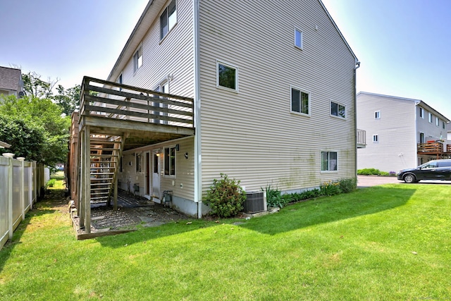 269 Captain Thomas Blvd Unit 12, West Haven, CT 06516 - view of home's exterior with stairway, a deck, and cooling unit