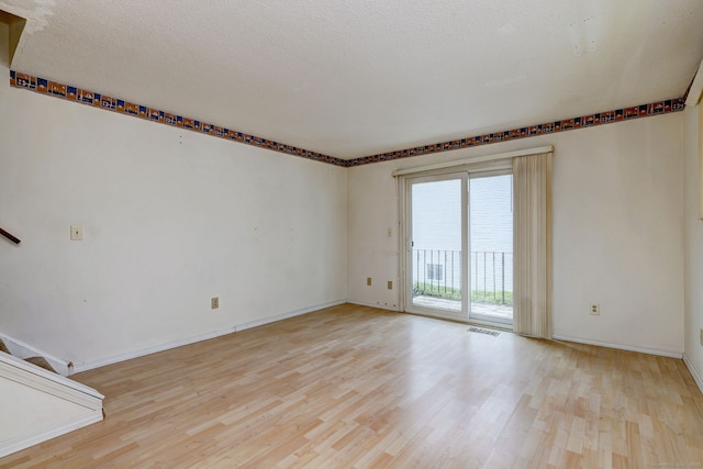 269 Captain Thomas Blvd Unit 12, West Haven, CT 06516 - empty room with light wood-type flooring, stairs, and baseboards