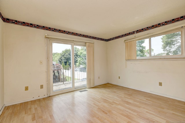 269 Captain Thomas Blvd Unit 12, West Haven, CT 06516 - empty room featuring light wood-style floors, plenty of natural light, and baseboards
