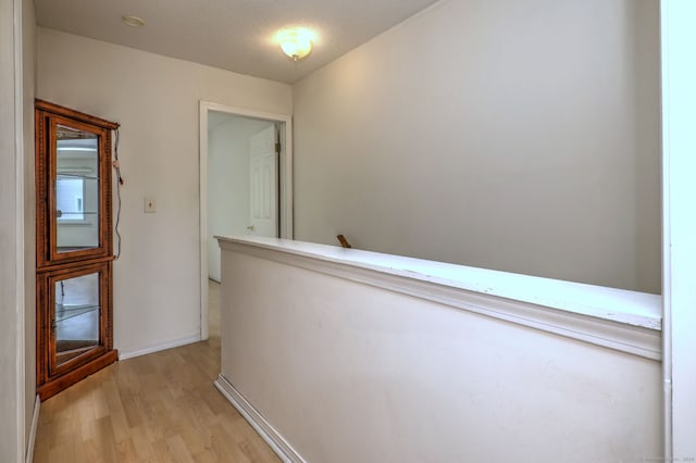 269 Captain Thomas Blvd Unit 12, West Haven, CT 06516 - corridor with light wood-style flooring, an upstairs landing, and baseboards