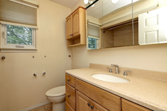 269 Captain Thomas Blvd Unit 12, West Haven, CT 06516 - bathroom featuring vanity, toilet, tile patterned flooring, baseboards, and a shower