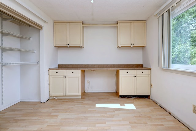 269 Captain Thomas Blvd Unit 12, West Haven, CT 06516 - unfurnished office featuring built in desk, light wood-type flooring, and healthy amount of natural light