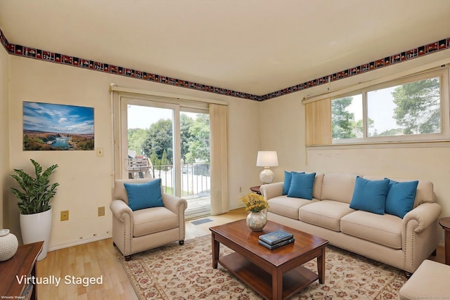 269 Captain Thomas Blvd Unit 12, West Haven, CT 06516 - living room with healthy amount of natural light and light wood-style flooring