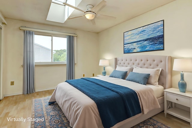 269 Captain Thomas Blvd Unit 12, West Haven, CT 06516 - bedroom featuring wood finished floors, baseboards, ceiling fan, and a skylight