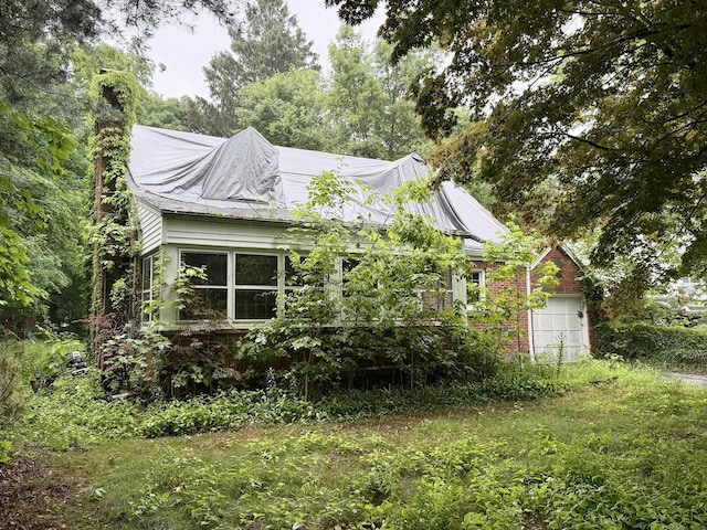 37 Thorpe Ave, Meriden, CT 06450 - view of side of home with a chimney