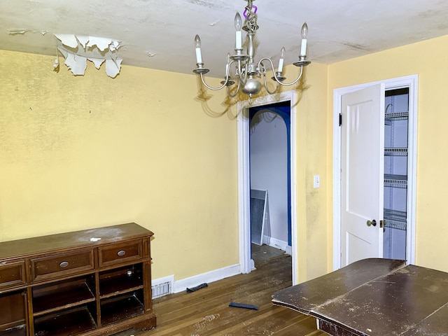 37 Thorpe Ave, Meriden, CT 06450 - unfurnished dining area featuring dark wood-style floors, baseboards, and a chandelier