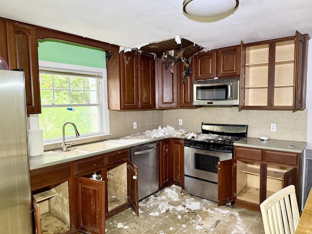 37 Thorpe Ave, Meriden, CT 06450 - kitchen featuring stainless steel appliances, a sink, light countertops, and backsplash