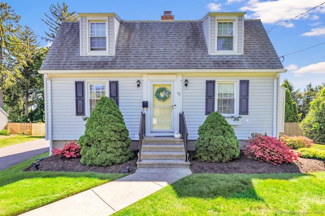 40 Cutspring Rd, Stratford, CT 06614 - view of front of house with a chimney and roof with shingles