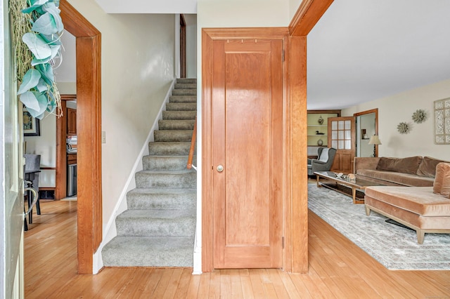 40 Cutspring Rd, Stratford, CT 06614 - staircase with wood-type flooring and baseboards
