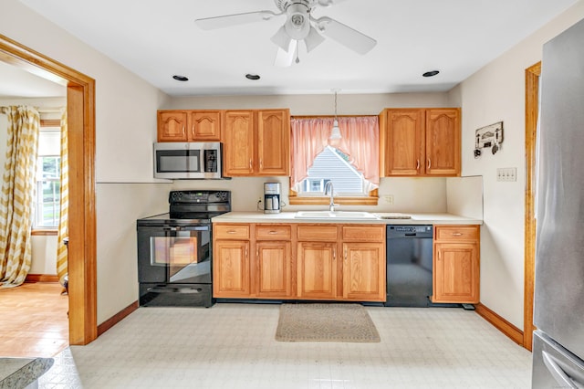 40 Cutspring Rd, Stratford, CT 06614 - kitchen with black appliances, light countertops, and a ceiling fan