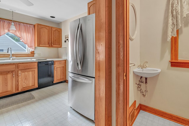 40 Cutspring Rd, Stratford, CT 06614 - kitchen with dishwasher, freestanding refrigerator, light flooring, light countertops, and decorative light fixtures
