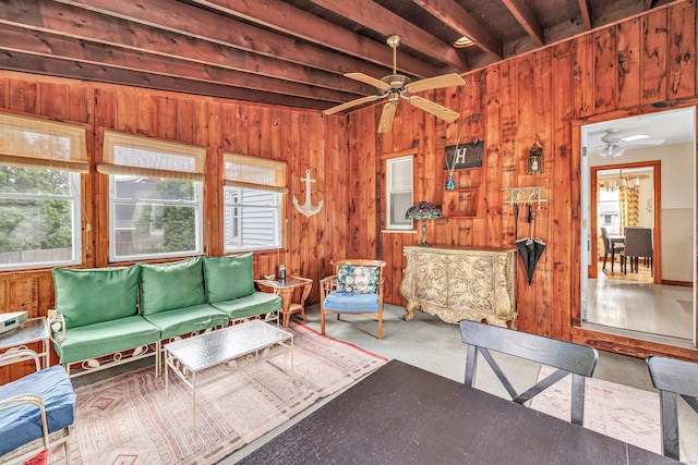 40 Cutspring Rd, Stratford, CT 06614 - living area with plenty of natural light, wooden walls, ceiling fan, and beam ceiling