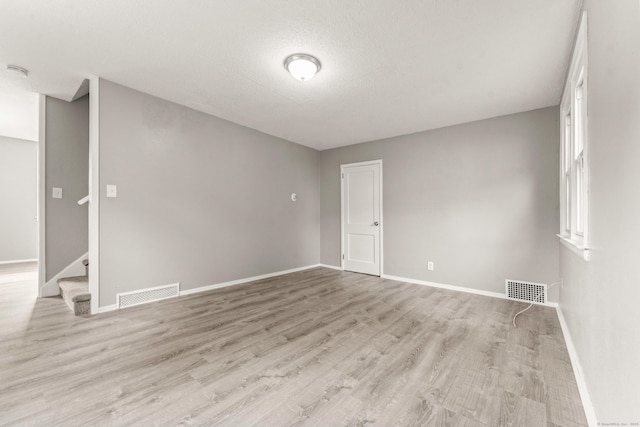 101 Cannon Rd, East Hartford, CT 06108 - unfurnished room with light wood-style flooring, baseboards, stairs, and a smoke detector