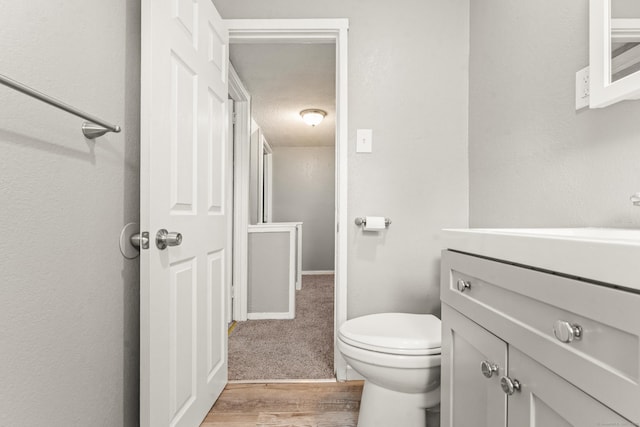 101 Cannon Rd, East Hartford, CT 06108 - bathroom with vanity, wood finished floors, and toilet