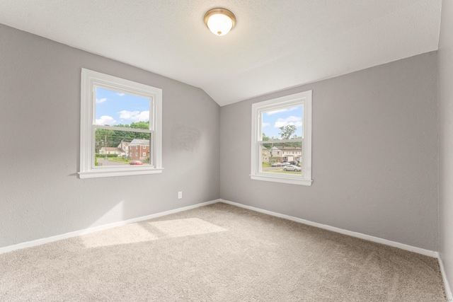 101 Cannon Rd, East Hartford, CT 06108 - spare room with lofted ceiling, carpet floors, and baseboards
