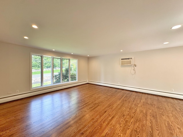 17 Currituck Rd, Newtown, CT 06470 - unfurnished room featuring recessed lighting, a wall mounted AC, wood finished floors, baseboards, and a baseboard heating unit