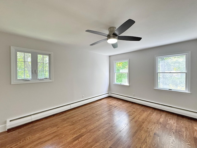 17 Currituck Rd, Newtown, CT 06470 - spare room with wood finished floors, ceiling fan, a baseboard radiator, and baseboards