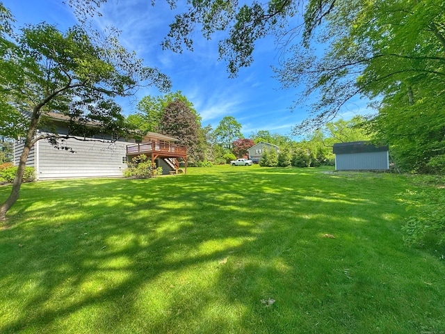 17 Currituck Rd, Newtown, CT 06470 - view of green lawn with a deck and stairs