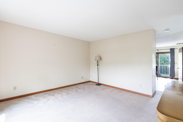 30 Sheila Ct Apt 31, Bristol, CT 06010 - spare room featuring light carpet, baseboards, and a smoke detector