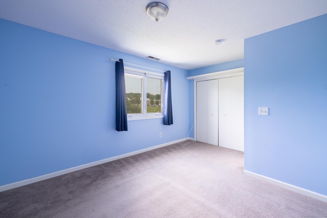 30 Sheila Ct Apt 31, Bristol, CT 06010 - unfurnished bedroom featuring carpet floors, a closet, and baseboards