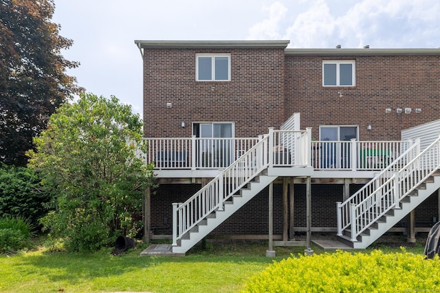 30 Sheila Ct Apt 31, Bristol, CT 06010 - rear view of property with stairway, a deck, and brick siding