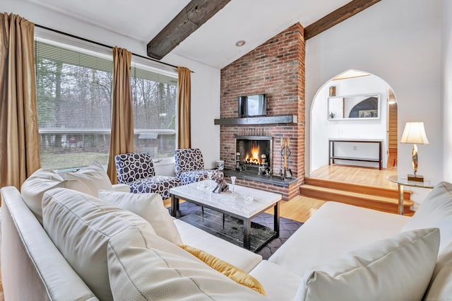 575 W Todd St, Hamden, CT 06518 - living room with wood finished floors, arched walkways, and a brick fireplace