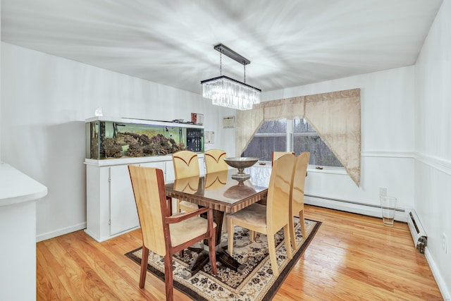 575 W Todd St, Hamden, CT 06518 - dining room featuring a chandelier, light wood-style flooring, and a baseboard heating unit