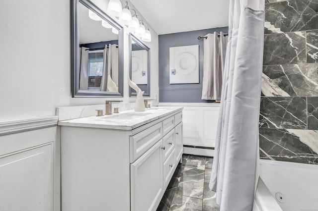 575 W Todd St, Hamden, CT 06518 - full bathroom featuring marble tiled floors, vanity, wainscoting, and a combined bath / shower with jetted tub