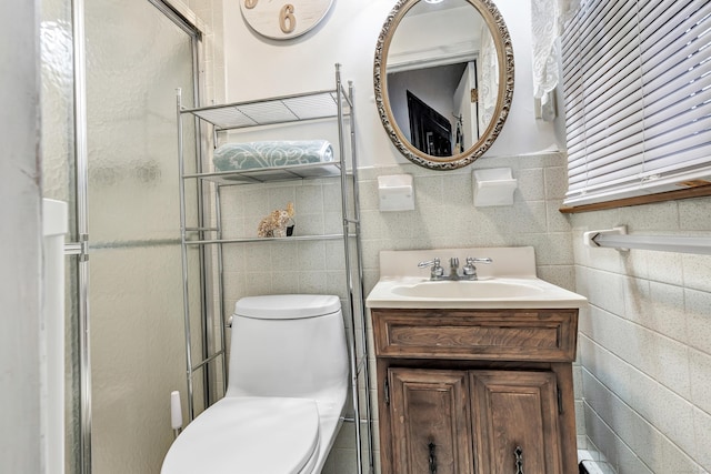 575 W Todd St, Hamden, CT 06518 - full bath featuring tile walls, toilet, vanity, and a shower with door