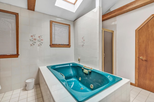 575 W Todd St, Hamden, CT 06518 - full bathroom with tile patterned floors, a skylight, tile walls, a stall shower, and a whirlpool tub