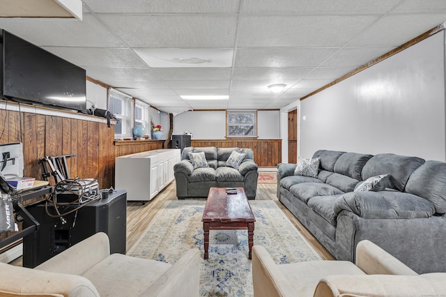 575 W Todd St, Hamden, CT 06518 - living room with light wood-type flooring, wood walls, wainscoting, and a drop ceiling