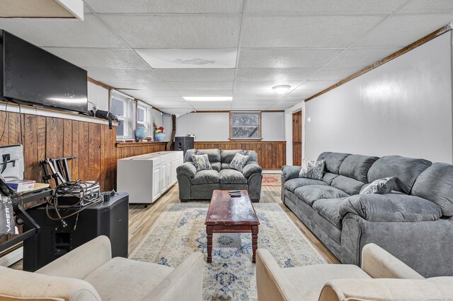 575 W Todd St, Hamden, CT 06518 - living area featuring light wood-style flooring, wooden walls, wainscoting, and a paneled ceiling