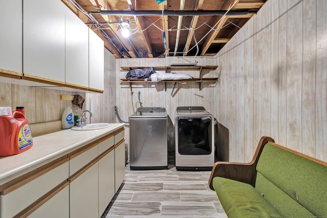 575 W Todd St, Hamden, CT 06518 - laundry area featuring washing machine and dryer, cabinet space, and wood walls