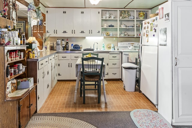28 Oak Dr, Woodstock, CT 06282 - kitchen with brick patterned flooring, white appliances, open shelves, white cabinetry, and stainless steel countertops