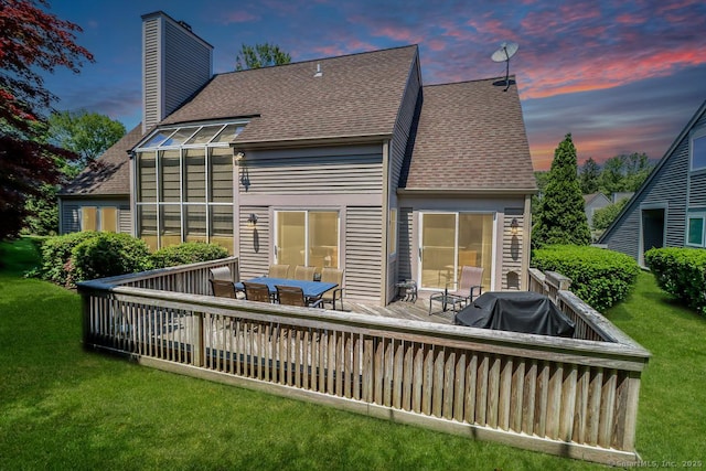 230 New Canaan Ave Apt 2, Norwalk, CT 06850 - back of house at dusk featuring roof with shingles, a deck, a chimney, and a yard