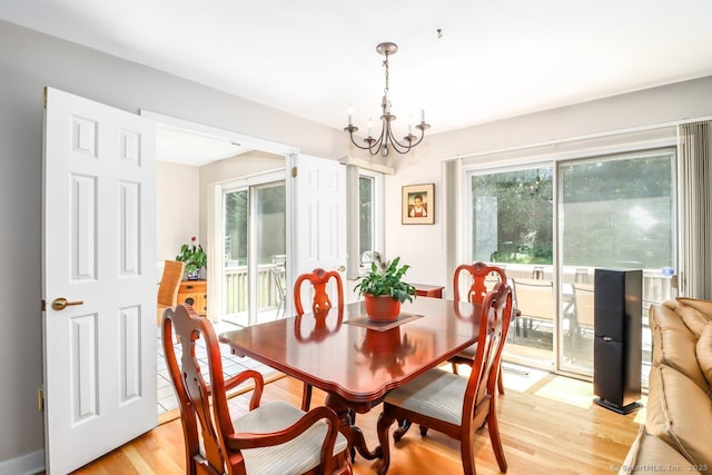 230 New Canaan Ave Apt 2, Norwalk, CT 06850 - dining space with light wood finished floors, healthy amount of natural light, and a chandelier
