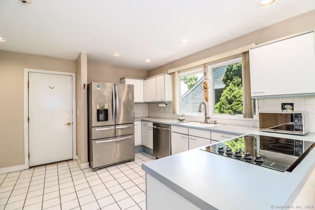 230 New Canaan Ave Apt 2, Norwalk, CT 06850 - kitchen featuring stainless steel appliances, a sink, decorative backsplash, white cabinets, and light countertops