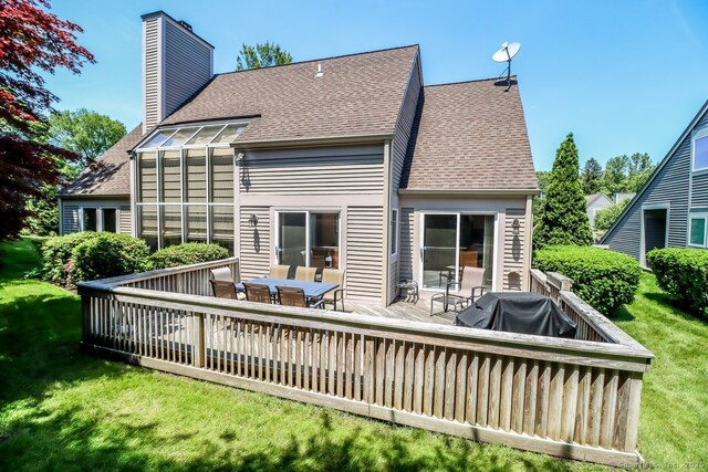 230 New Canaan Ave Apt 2, Norwalk, CT 06850 - back of property with roof with shingles, a chimney, a deck, and a lawn