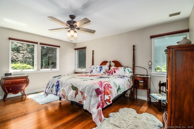 230 New Canaan Ave Apt 2, Norwalk, CT 06850 - bedroom featuring multiple windows, baseboards, wood finished floors, and ceiling fan